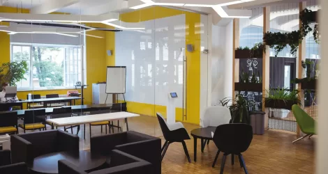 View of empty modern office with sofa, table, chair